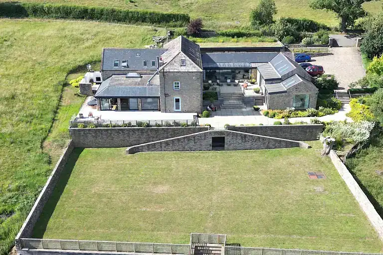 Aerial view of Highleases Farm with surrounding gardens and fields in Richmond.