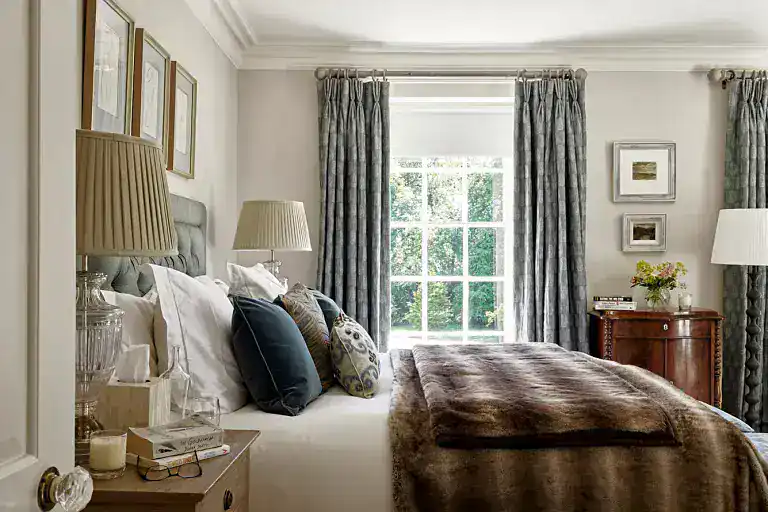 Bright and stylish bedroom with large window and plush bedding near Ripon.