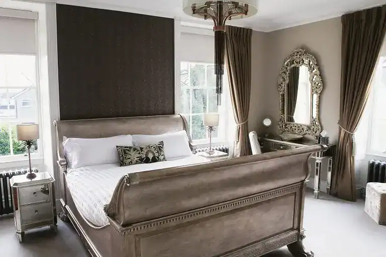 Luxurious bedroom with antique furniture and classic decor in Pateley Bridge.