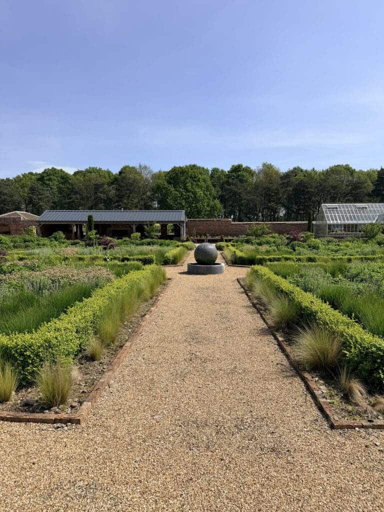 Beautiful garden path at Yorkshire Escapes near York with lush greenery.