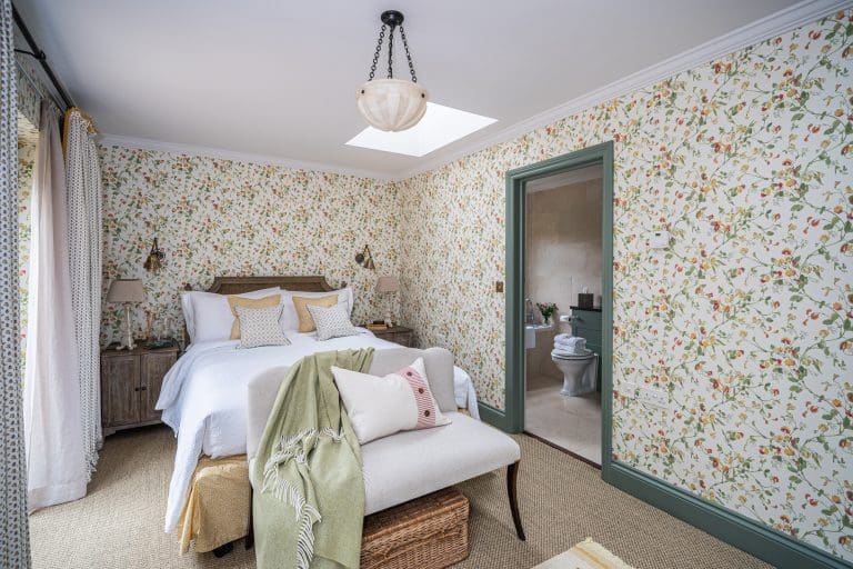 Cozy bedroom with floral wallpaper and elegant decor in North York Moors.