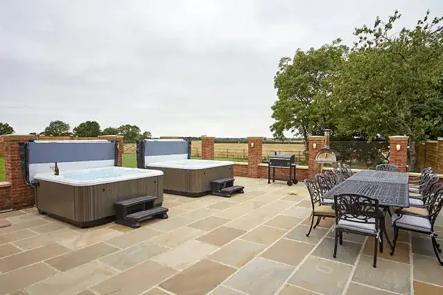 Outdoor hot tubs and dining area at Pasture House, Yorkshire Coast.