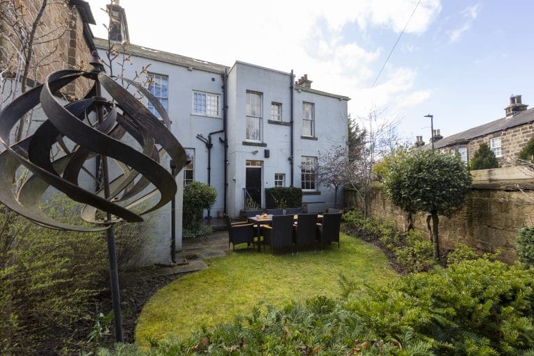 Backyard garden of Granby House in Harrogate with outdoor dining area.