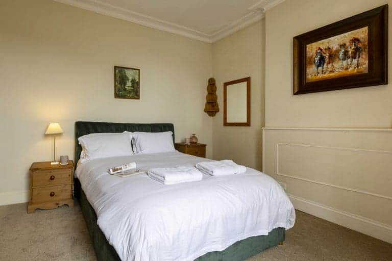 Comfortable bedroom in Granby House, Harrogate with elegant decor and cosy atmosphere.