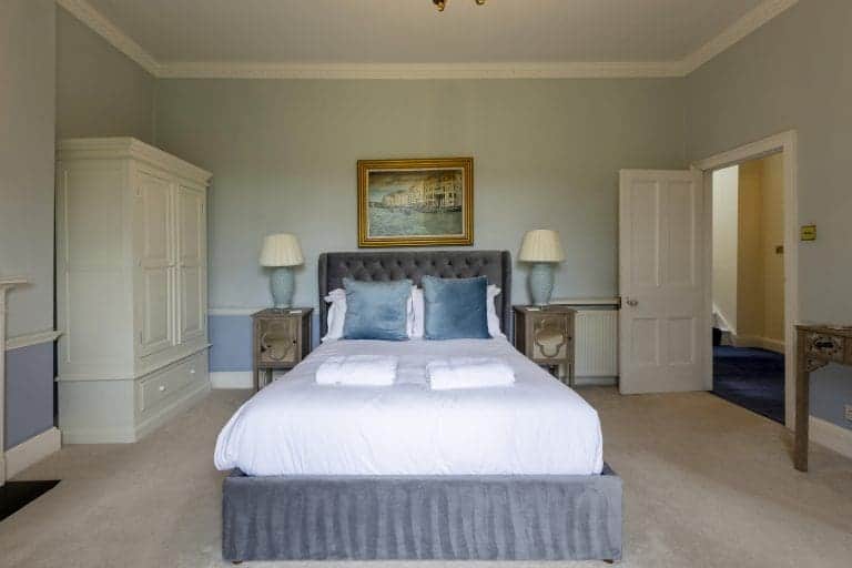 Elegant bedroom in Granby House, Harrogate with classic decor and soft lighting.