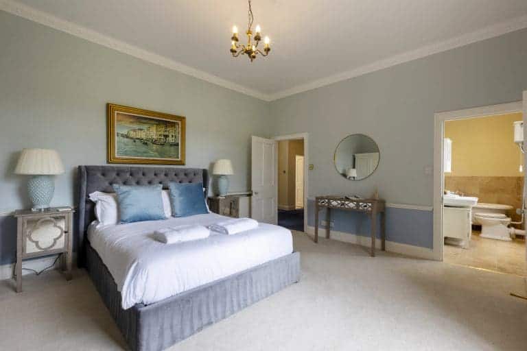 Elegant bedroom in Granby House, Harrogate with classic decor and soft colours.