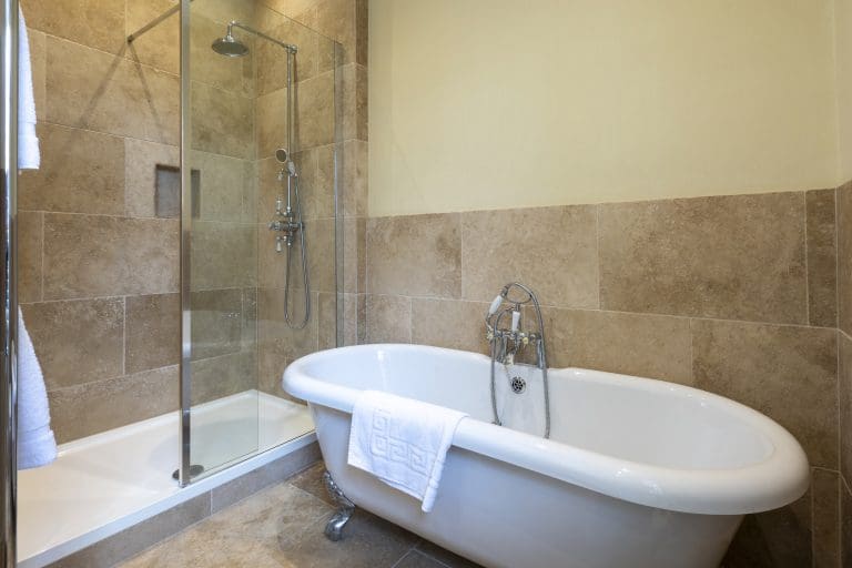 Modern bathroom with a freestanding bathtub and walk-in shower in Yorkshire Escapes.