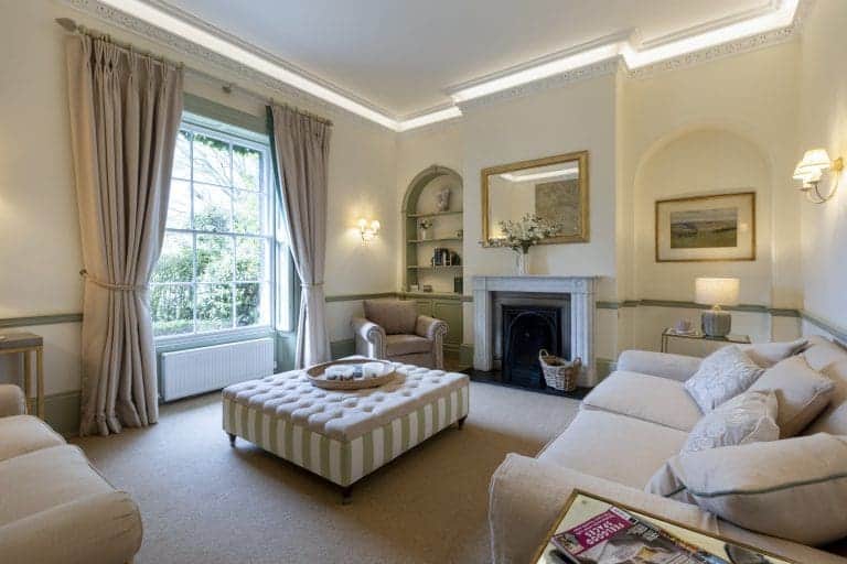 Elegant living room at Granby House, Harrogate with classic decor and large window.