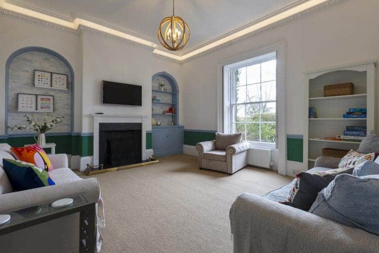 Spacious living room in Granby House, Harrogate with modern decor and large window.