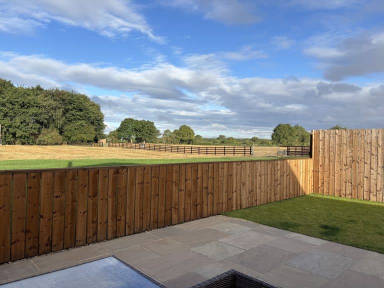 Scenic view from Catterton Barn with wooden fence and countryside.