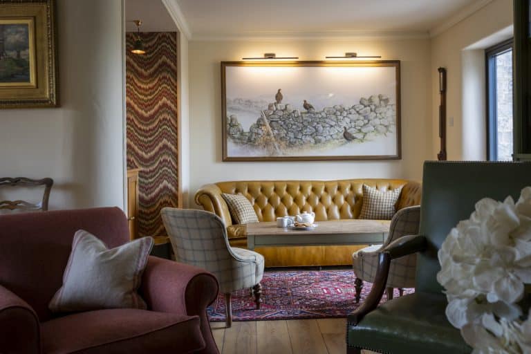 Elegant living room with vintage furniture and artwork in Yorkshire Dales.