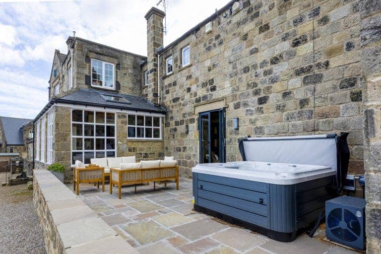 Charming stone cottage with outdoor seating and hot tub in Yorkshire Dales.