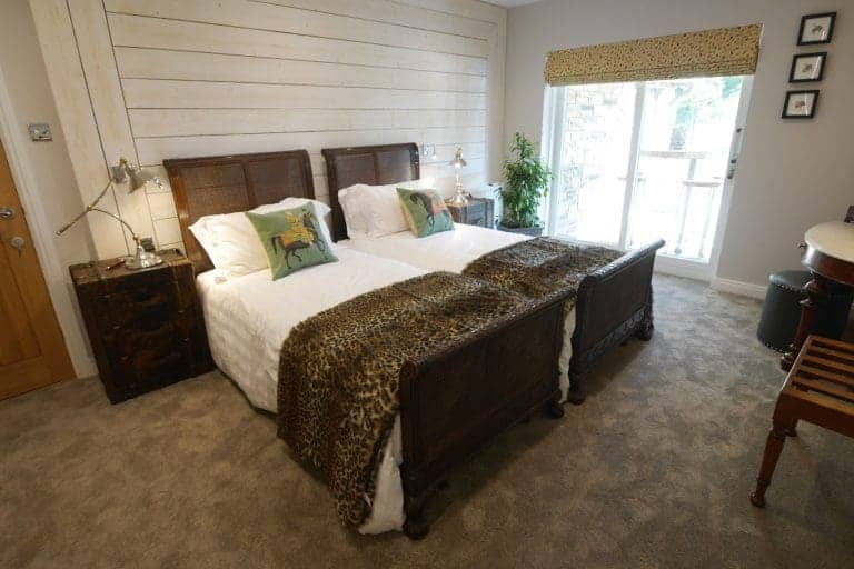 Cozy bedroom at Cedar House, East Yorkshire with twin beds and natural light.