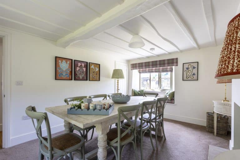 Cozy dining room at Abbey Cottage near Helmsley with rustic decor and natural light.