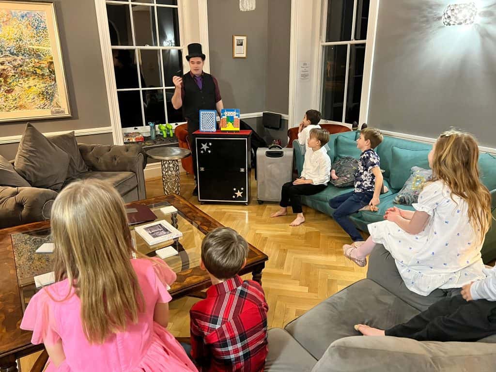 Magician entertaining children at a birthday party in Pateley Bridge.