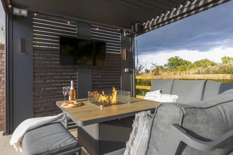 Outdoor patio with seating and a fire pit at Strathearn House near York.
