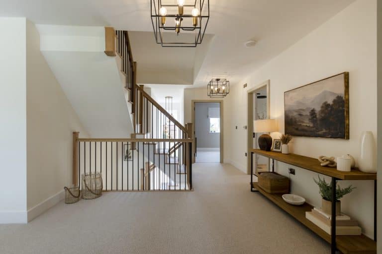 Bright and airy hallway with staircase and modern decor at Strathearn House near York.