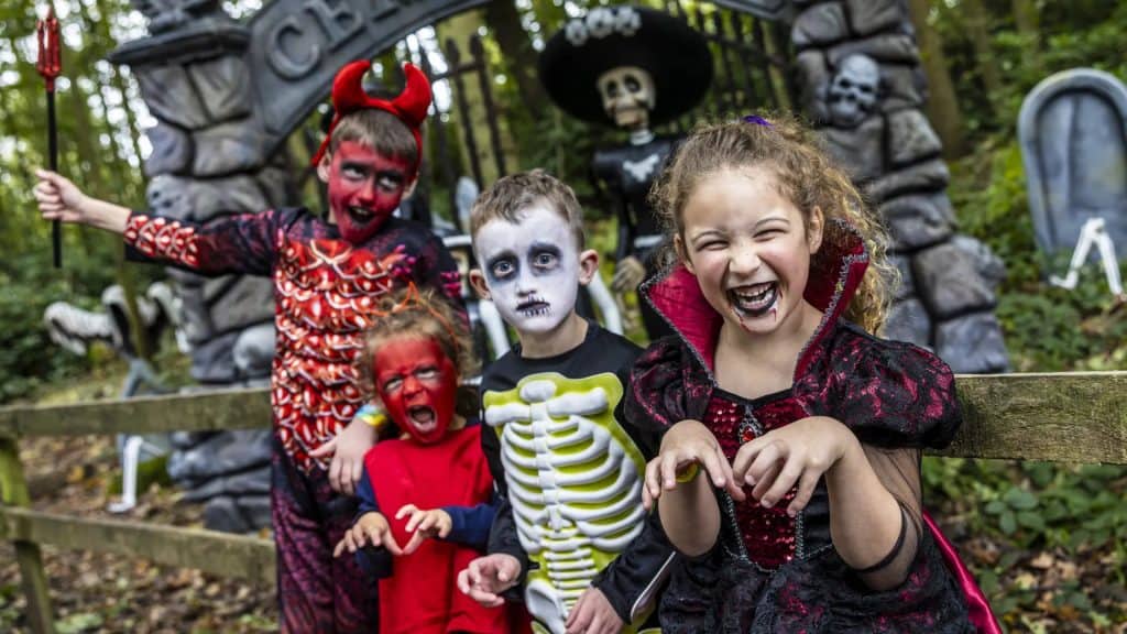 Children in Halloween costumes enjoying a spooky outdoor event in Yorkshire.